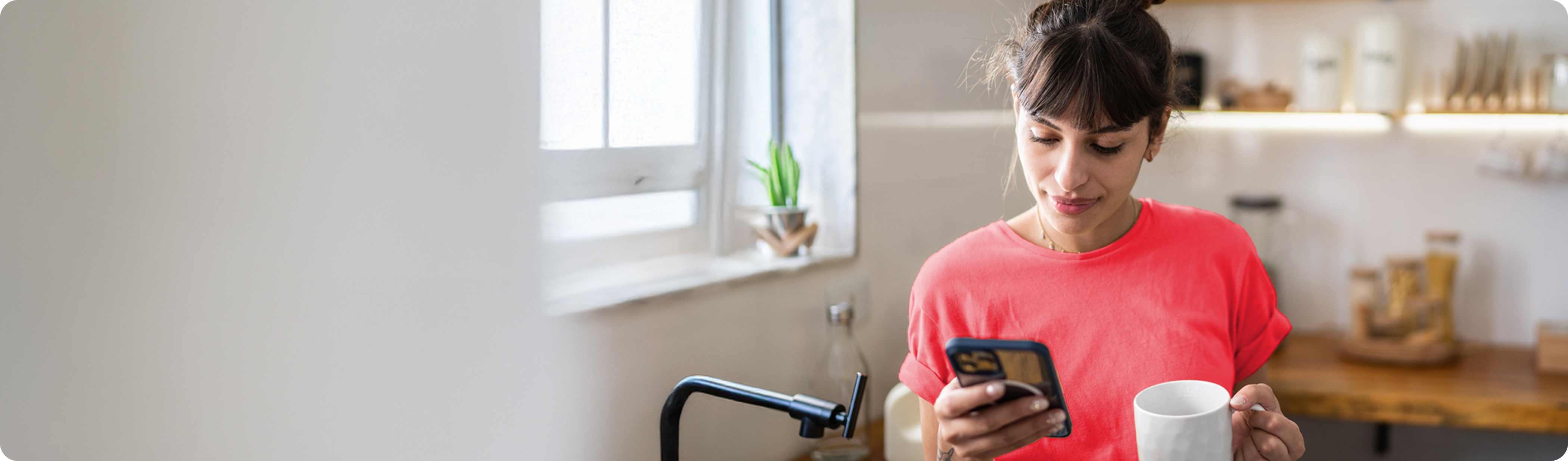 Woman drinking coffee hiding her cell phone